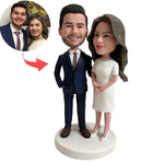 Gepersonaliseerde beeldjes van bruid en bruidegom als huwelijksgeschenk.