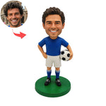 Op maat gemaakte bobblehead van een voetballer met een bal in zijn hand
