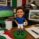 Op maat gemaakte bobblehead van een voetballer met een bal in zijn hand