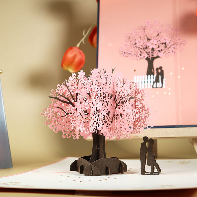 Romantisch paar onder kersenboom 3D pop-up wenskaart