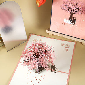 Romantisch paar onder kersenboom 3D pop-up wenskaart